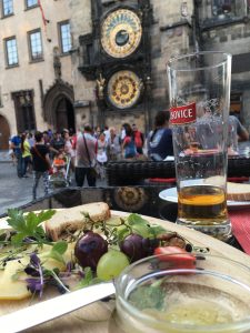 Beer, people watching and a super old clock; Score.