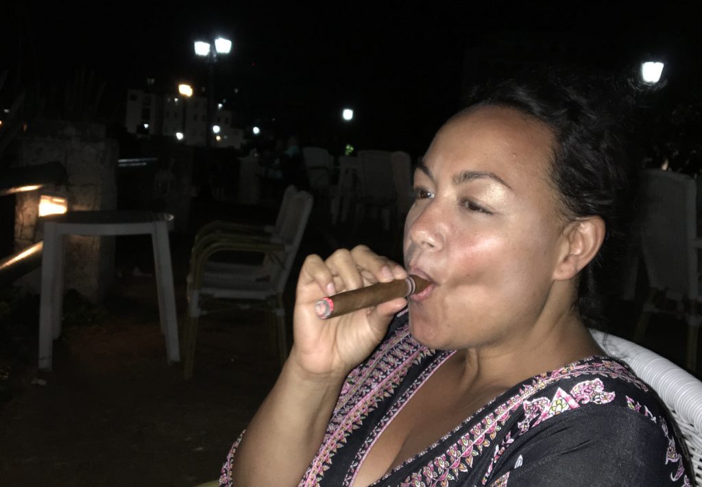 A Montecristo cigar on the lavish grounds of the Hotel Nacional