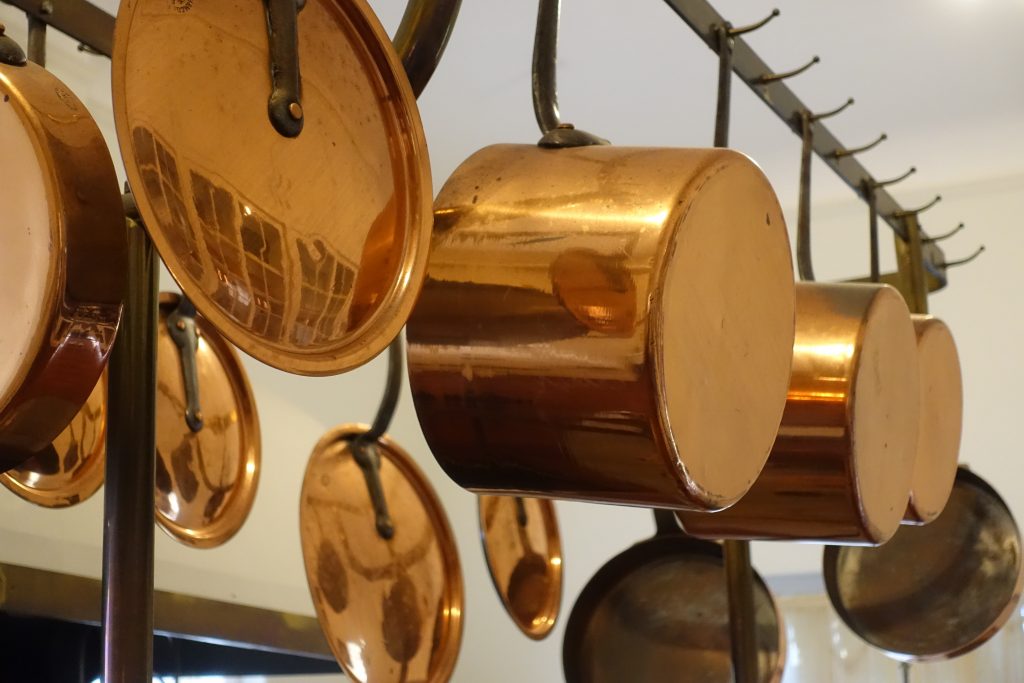 Even the pots and pans have personality in the large but otherwise basic kitchen.