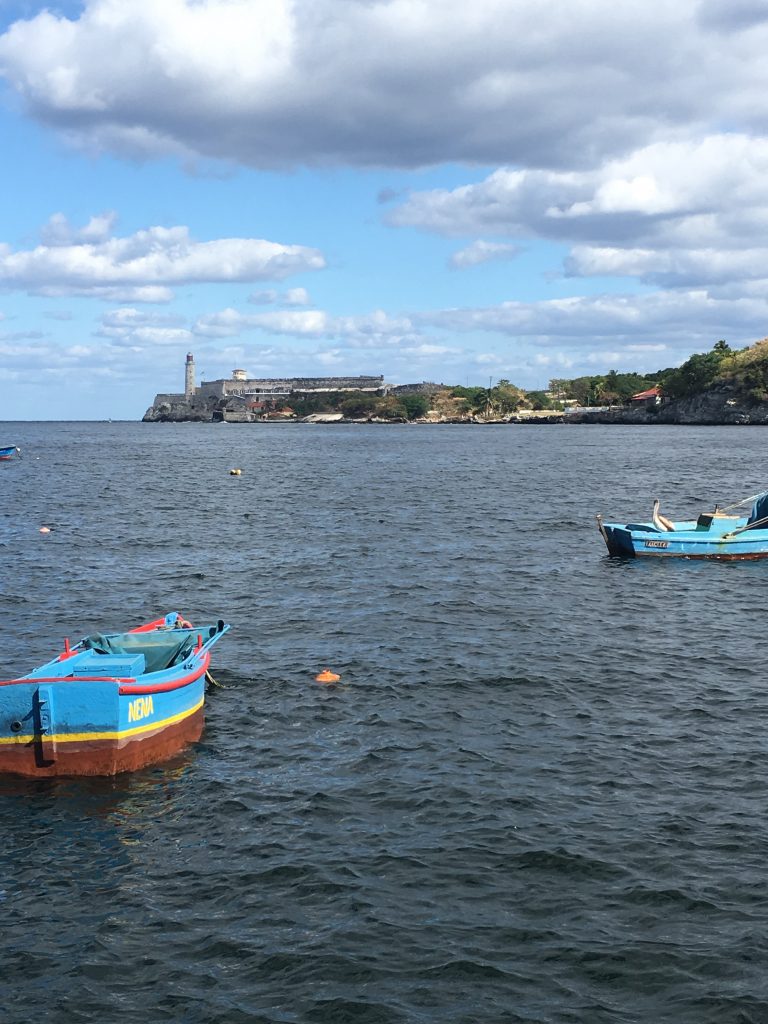 Fishing boats in the Cana de Entrada, the Fortaleza de San Carlos de la Cabana in the distance